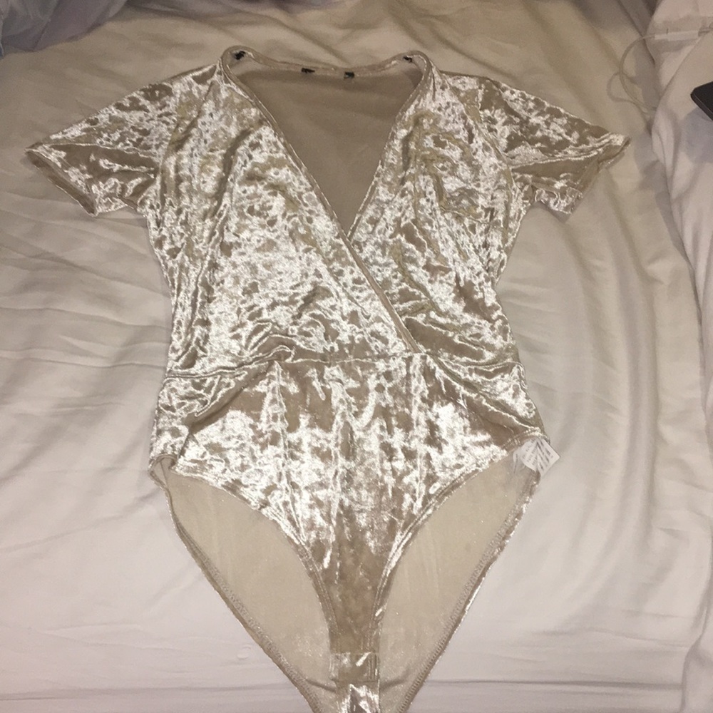 never worn suede bodysuit